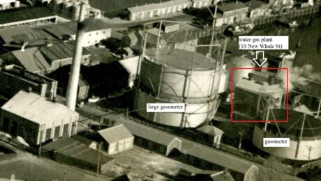 A detail of an aerial view of the downtown Nantucket waterfront from the 1930s, annotated to label the building at 10 New Whale Street and two gasometers.